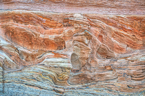 Sandstone is a clastic sedimentary rock composed mainly of sand-sized silicate grains. photo
