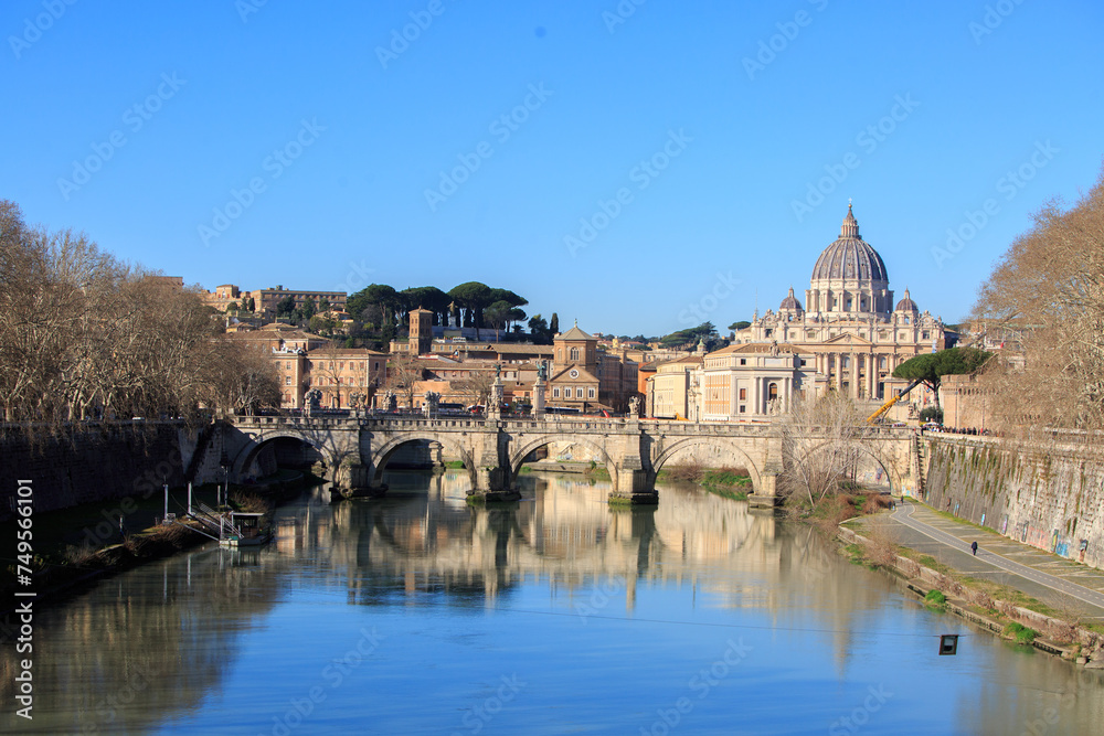 Landscape view of The Tiber River, with reflection of old buildings and bridge, it is the third-longest river in Italy and the longest in Central Italy