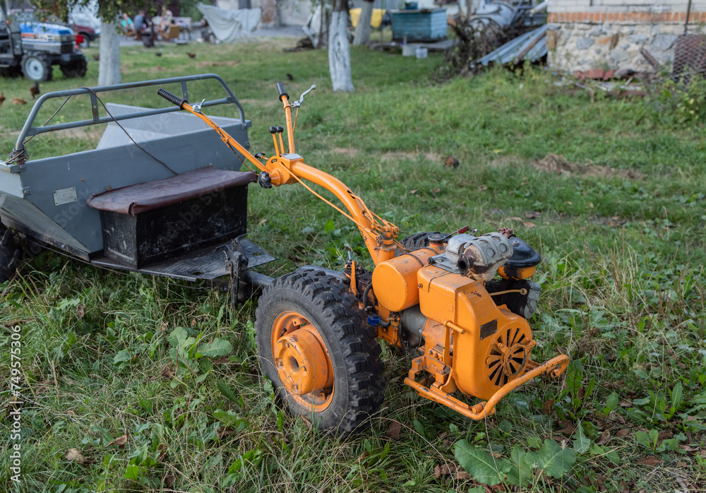 Obraz premium Tiller walk-behind tractor in the countryside