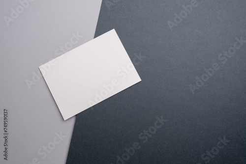 Blank business card, postcard on a colored background. Place for text and information. Mockup © Iuliia Pilipeichenko