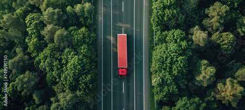 Red Wagon truck driving on the highway, aerial shot over forest