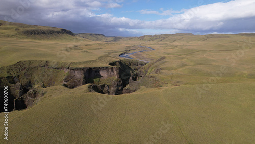 Fjadrargljufur (or Fjadra Canyon) is a 100 m deep and about 2 kilometres long serpentine canyon with the Fjaðrá river flowing through it, South Iceland.