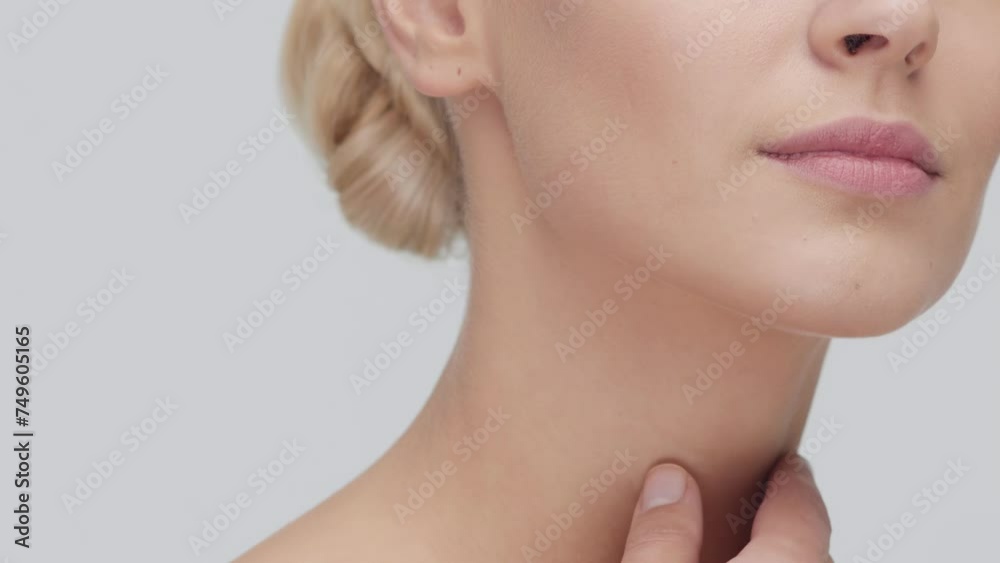 Studio portrait of young, beautiful and natural blond woman applying skin care cream. Face lifting, cosmetics and make-up concept. Studio portrait of young, beautiful and natural blond woman applying skin care cream. Face lifting, cosmetics and make-up concept.