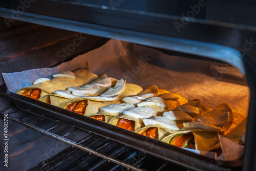 Homemade mexican enchiladas on baking oven tray
