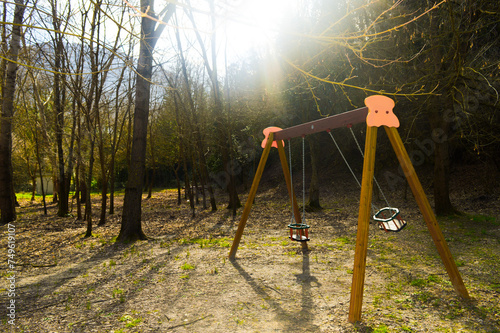 Old swing in children's park. taken in Bellegra, Italy photo