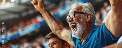 A delighted mature man and his elderly dad cheering on their favorite team together at the stadium during a sports event.