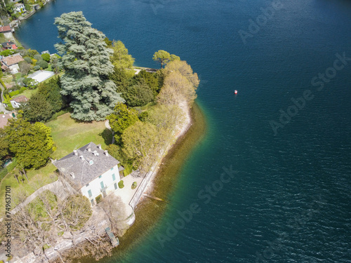 Swiss mountain lake in summer surrounded by lush green meadows and alpine peaks. photo
