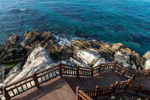 High-angle view of the wooden footpath at the seaside photo