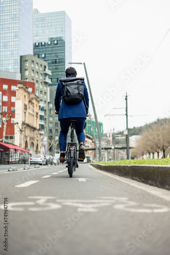 vertical portrait Sustainable Urban Commute  Businessman Cycling Safely in Dedicated Bike Lane