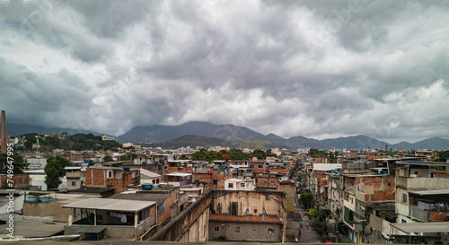 A favela in Rio de Janerio on a cloudy day as seen from a highway