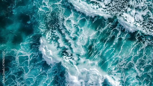 aerial view of turquoise ocean water with splashes and foam for abstract natural background and texture photo