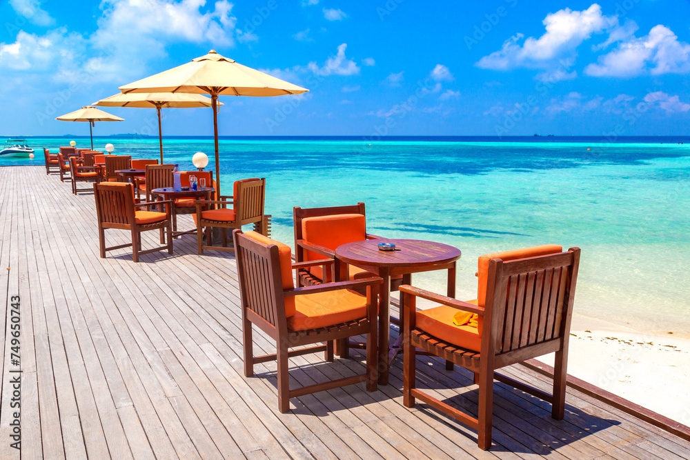 Fototapeta premium Table and chairs at tropical restaurant