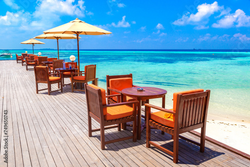 Table and chairs at tropical restaurant