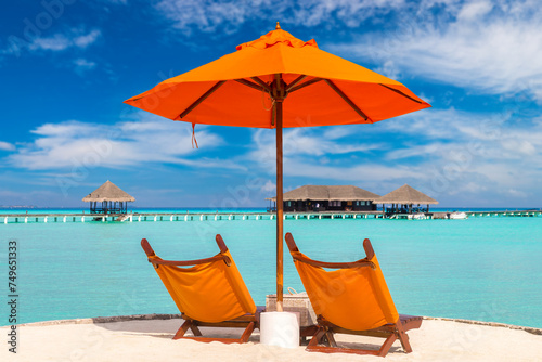 Sun bed and parasol at tropical beach