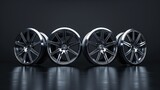 A set of four glossy metallic car rims displayed against a dark background