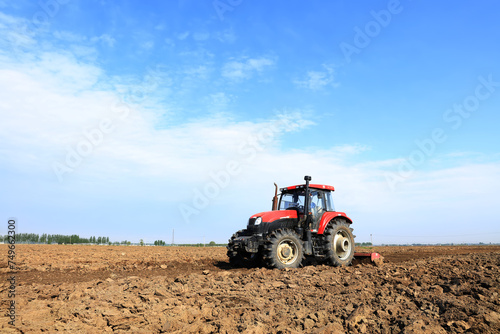 In spring  farmers use farm machinery to grow peanuts