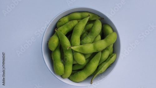 green soy beans in a bowl isolate on white