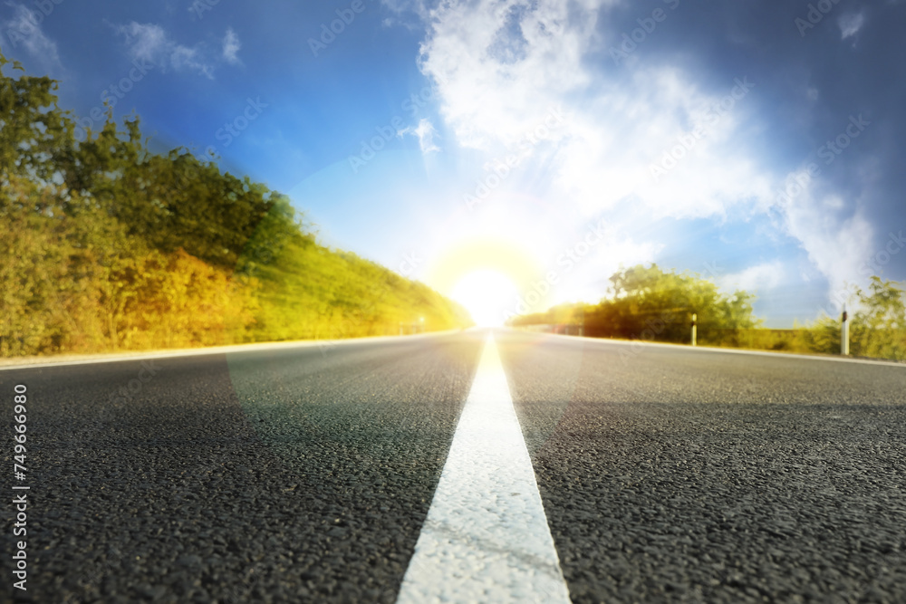 Empty asphalt road under beautiful blue sky Empty asphalt road under beautiful blue sky