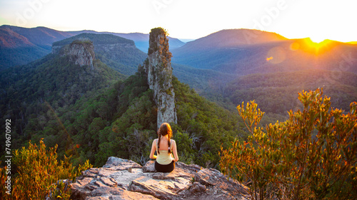 Bild auf Leinwand hiker girl enjoys the sunset over unique australian mountains in main range nati