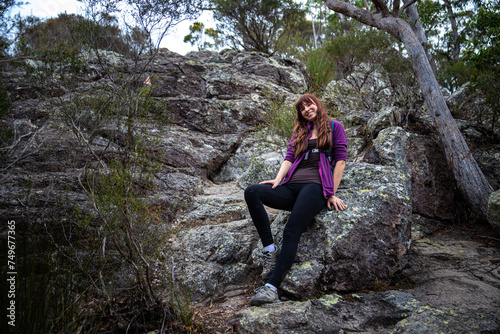 brave fit girl climbing to the top of mount maroon  rock scrambling in mount barney national park near brisbane, queensland, australia © Jakub