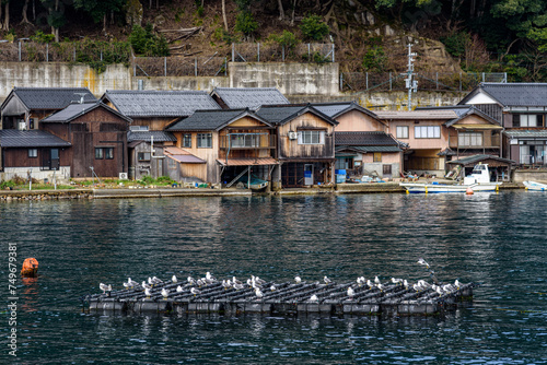 Traditional wooden fishermen boathouses in Ine north Kyoto prefecture on the Sea of Japan photo