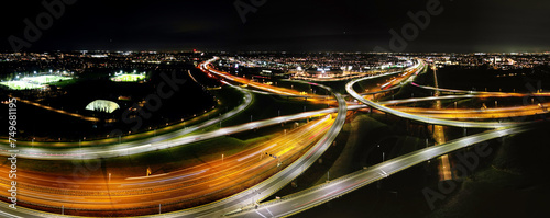 фотографія Aerial view at night of a cloverleaf interchange highway, The Haque, Holland