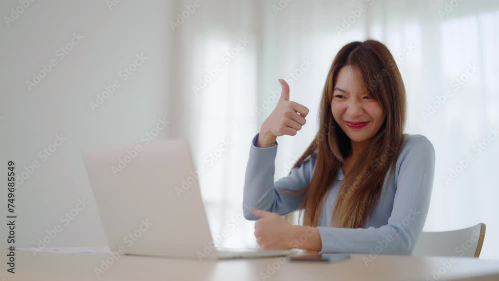 Young asian woman working on computer laptop at house. Work at home, Video conference, Video call, Student learning online class, meeting conference Young asian woman working on computer laptop at house. Work at home, Video conference, Video call, Student learning online class, meeting conference