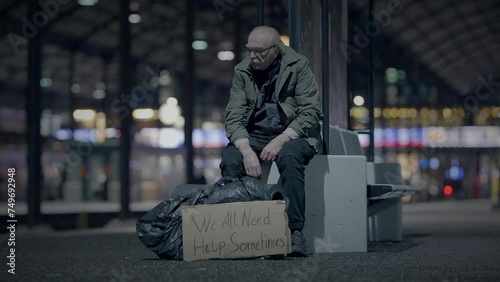 Elderly Homeless Man Suffering from Poverty Looking for Help at Train Station