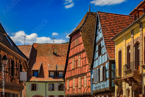 Fototapeta Naklejka Na Ścianę i Meble -  Traditional half timbered houses and grapevines in a vineyard on a hill in a popular village on the Alsatian Wine Route in Kientzheim, France