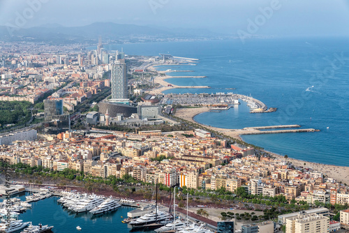 Barcelona aerial skyline panorama, beach with palms, city by the sea