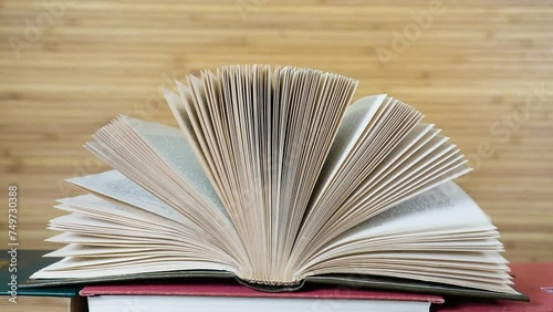 Open old book on natural background. Educational background library school concept.