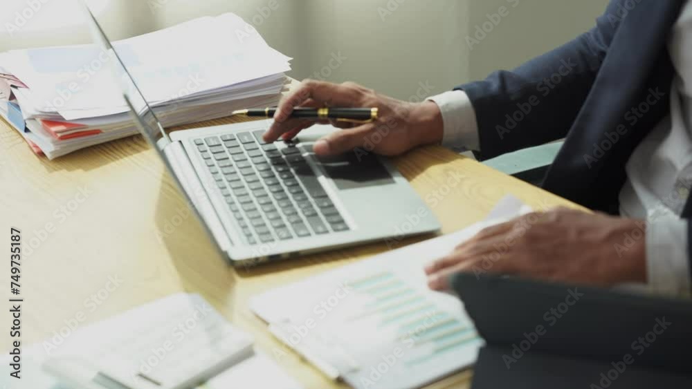 Businessman checks income and expenses from summary graph for accounting accuracy, business auditing concept, 4k close-up video Businessman checks income and expenses from summary graph for accounting accuracy, business auditing concept, 4k close-up video