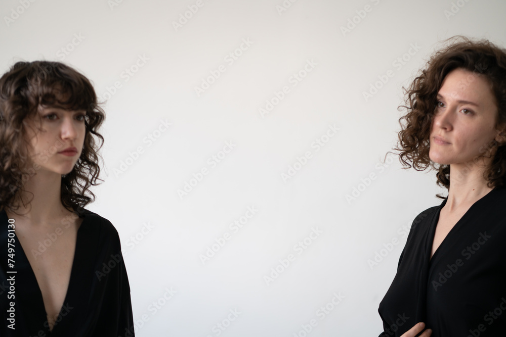 portrait of a young beautiful woman with curly hair in the studio portrait of a young beautiful woman with curly hair in the studio