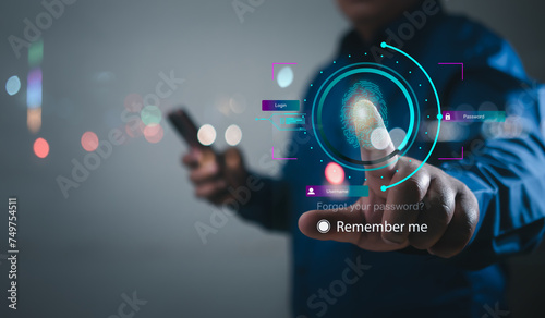 businessman using thumb to scan finger print or for digital processing biometric identification to access security system includes internet banking, cloud system and mobile phone , Cyber security