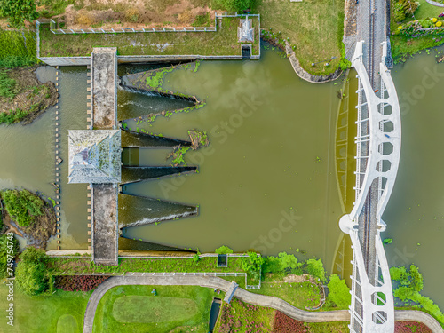 Aerial top view, Tha Chomphu White Bridge. It is a railway bridge across the river and is a beautiful white arch shaped cement bridge. It is an important tourist attraction lamphun province, thailand.