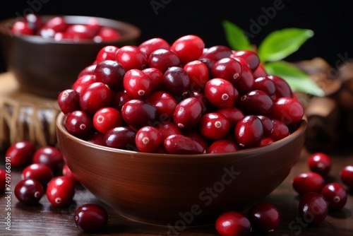 Organic ripe cranberries in a wooden bowl on rustic wooden background for thanksgiving recipes