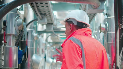 Engineers check and adjust the valves to ensure the proper amount of water flows into the air conditioning pipes.
