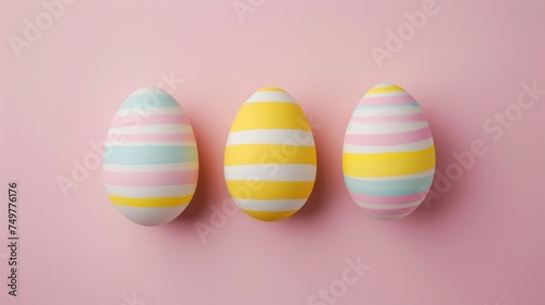 Three Easter eggs with delicate striped patterns in soft pastels are symmetrically aligned against a gentle pink background, exuding a serene and elegant vibe.