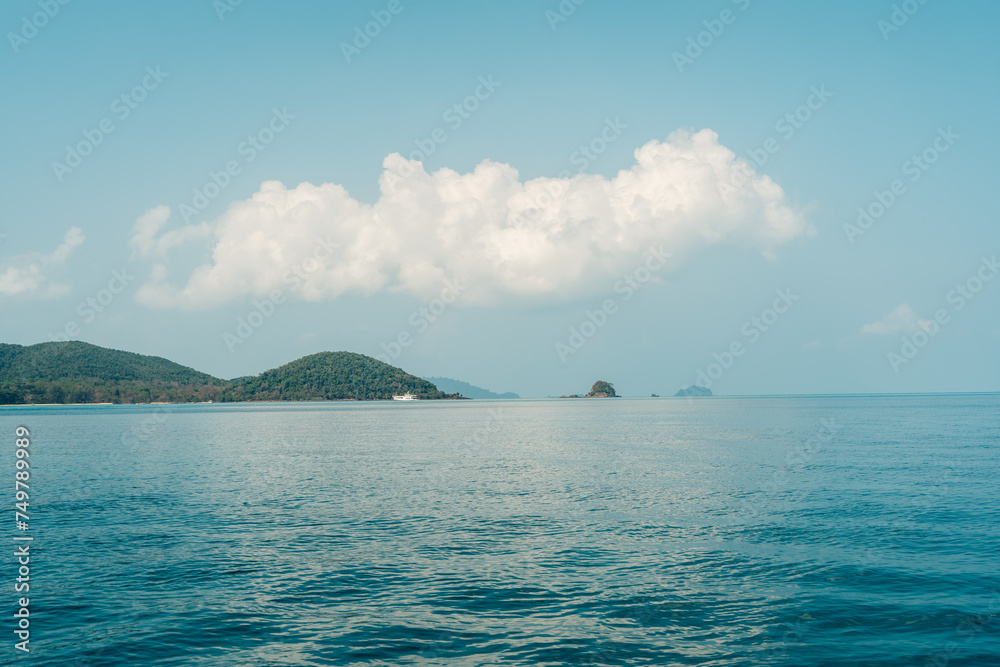 Seascape with Majestic Mountains, Tranquil Island, and Clear Blue Sky