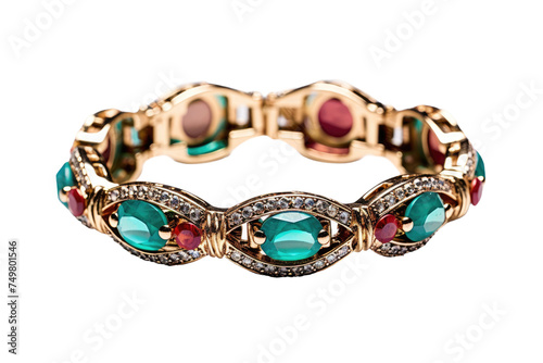 Gold Bracelet With Green and Red Stones. A gold bracelet adorned with vibrant green and red stones shines in the light showcasing its intricate design and luxurious appeal.