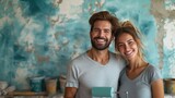 Joyful Couple During Home Renovation, cheerful man and woman, covered in paint splatters, share a joyous moment with a paint roller in hand against a creatively painted wall
