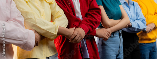 Panoramic banner young asian startup company employee wearing colorful casual wear stand in line and join hand together symbolize creative teamwork, job employment, HR agency recruitment. Synergic