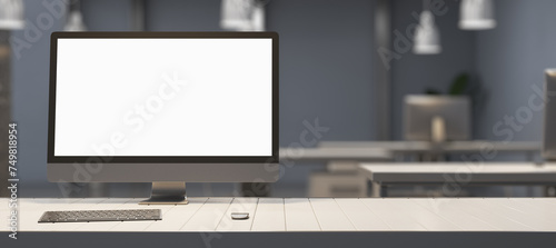 Creative designer table with empty white mock up computer display, supplies and blurry office interior in the background. 3D Rendering.