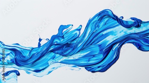 Dynamic blue paint splash isolated on white background, representing fluid motion and creative design elements. Artistic expression and color dynamics.