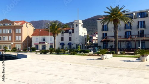 Buildings on a seaside promenade. Coastal town boulevard. Porto Montenegro, Tivat, Montenegro. Europe. photo