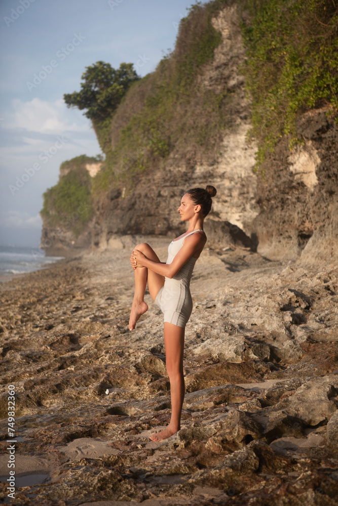 Woman Doing Yoga On The Beach Woman Doing Yoga On The Beach