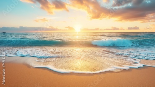 A golden sand beach faces a blue ocean, cloud cover, and a setting sun.