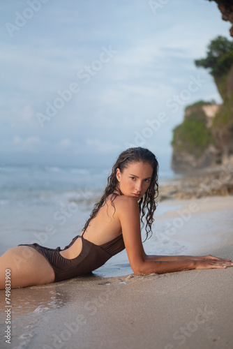 Attractive Woman On The Rocky Seashore On Bali Island