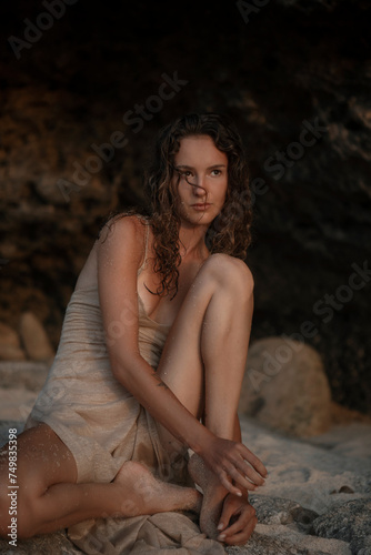 Attractive Woman On The Rocky Seashore On Bali Island