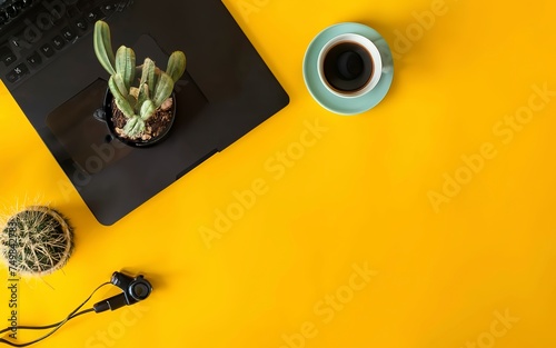 Laptop computer and coffee cup, with Camera and Cactus tree. External hard disk with USB on pastel background yellow